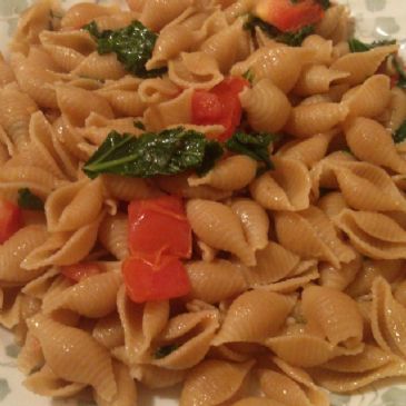 Whole Grain Shells with Kale, Spinach, and Tomato in a Garlic Vegan Butter Sauce