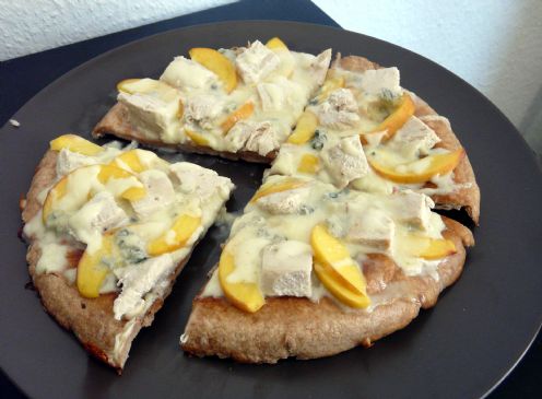 Pizza with gorgonzola, peach and chicken breast