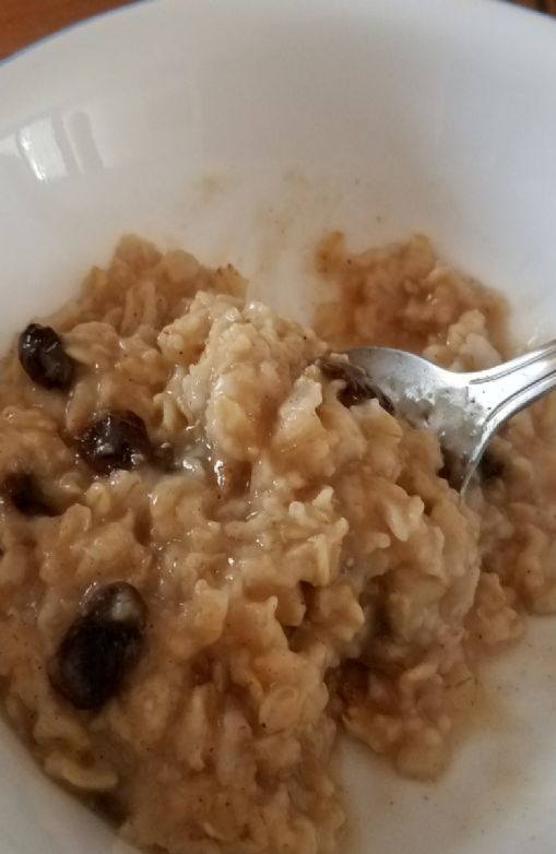 Stovetop (microwaved) oatmeal, b sugar and raisins