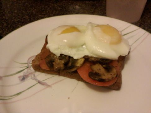 Poached eggs with mushrooms and tomatoes