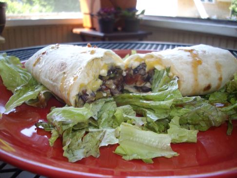Left Overs Burritos over a bed of lettuces.