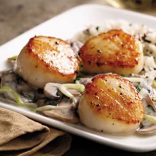 Seared Scallops with Brandied Leeks and Mushrooms - EatingWell
