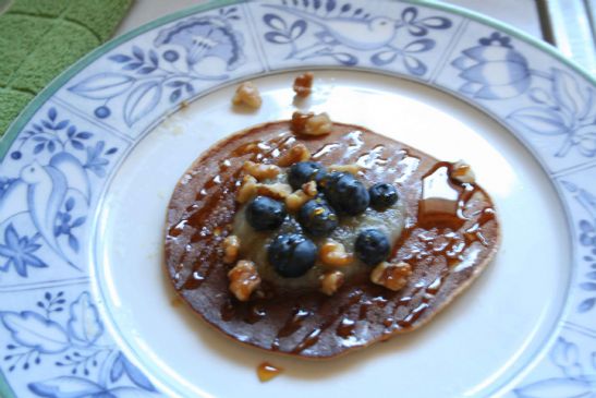 Pancakes topped with Applesauce, Blueberries and Walnuts