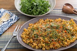 Pork Bolognese and Mafalda Pasta with English Peas and Arugula Salad