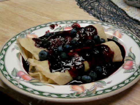 Crepes with cottage cheese blueberry-vanilla filling and blueberry sauce