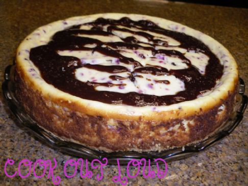 Chocolate Truffle Cran-Orange Cheesecake (by www.cookoutloud.com)