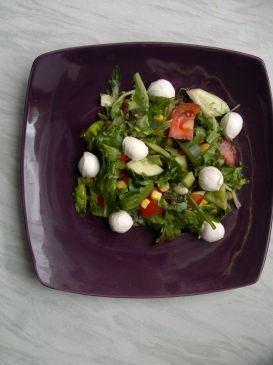 Mixed green leaf salad with tomato, corn, peppers