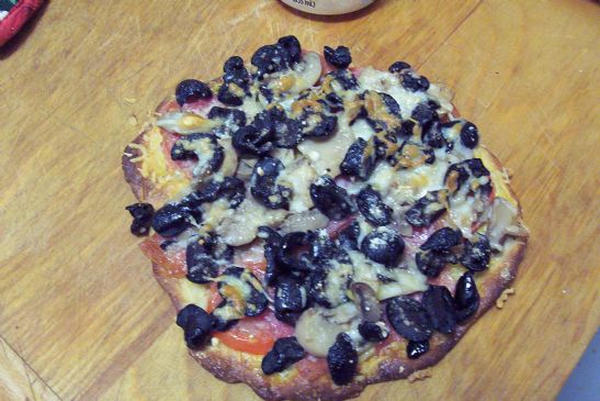 Black olive, mushroom pizza